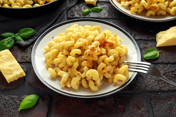 Homemade baked macaroni and cheese with cheddar served on plate