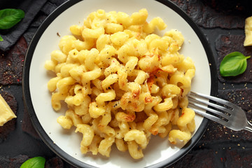 Homemade baked macaroni and cheese with cheddar served on plate