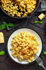 Homemade baked macaroni and cheese with cheddar served on plate