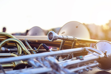wind instruments lying on a table against a blurred background