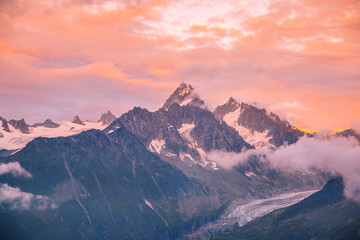 Fototapeta na wymiar Cloudy Sunset over Iconic Mont-Blanc Mountains Range and Glaciers.