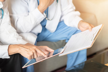 Hospital doctor teamwork, orthopedic surgeon, orthopedist, ER surgery team in medical clinic office meeting room discussing on diagnostic exam on patient care operation, professional teamwork concept