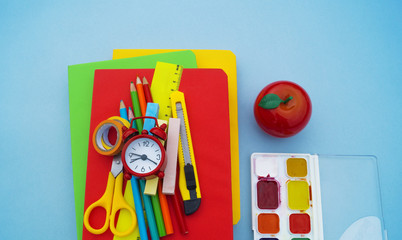 School supplies on blue background. Back to school