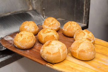 Bread just out from oven. Freshly baked breads, taken out with a shovel.