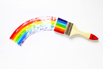 A brush draws a maple leaf painted