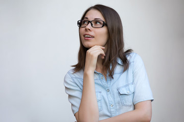 Woman in eyeglasses search idea on white background