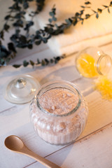 pink and yellow bath salt on white wooden table