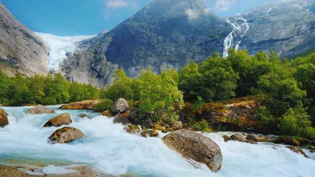 The incredible nature of Norway is a turbulent river from the melted waters of the Briksdal Glacier