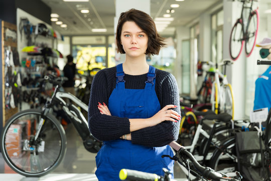 Positive professional woman standing in shop