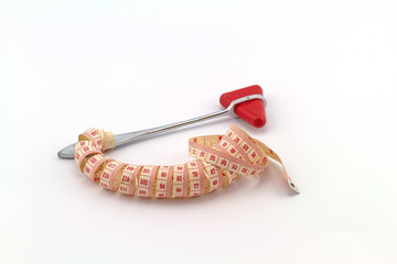 Pink tape measuring and knee jerk medical object  on white background