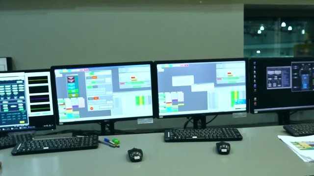 Slow Motion: Male Asian engineers are operating in a system of radiation control