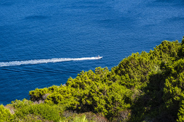Alghero, Sardinia Italy - Panoramic view of the Gulf of Alghero with cliffs of Cape Cappo Caccia over the Neptune’s Grotto