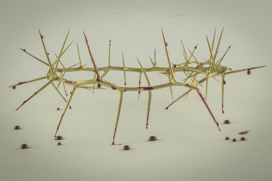 Crown of thorns with blood droplets on grunge background - Abstract image of gold crown as religion concept denoting Jesus Christ's suffering on the cross