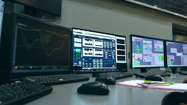 Slow Motion: Male Asian engineers are operating in a system of radiation control