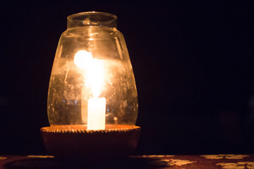 Candle in a Pot Under the Glass