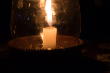 Candle in a Pot Under the Glass