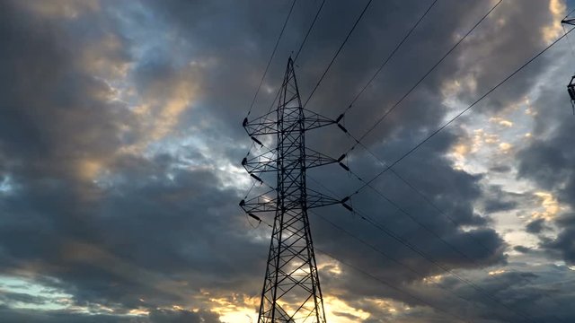Timelapse silhouette of high voltage electrical pole structure