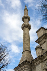 Detail of a stone minaret of the new mosque of Eminonu in Istanbul, Turkey, a symbol of islamic...