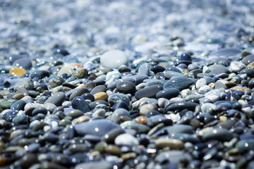 Abstract texture of the colored stones on the beach.