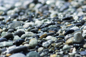 Abstract texture of the colored stones on the beach.
