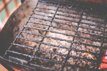 Closeup of dirty and burnt barbecue grill grates. Risk factor of cancers. Unhealthy food