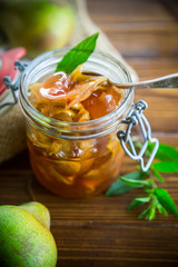 sweet fruit jam with apples and pears in a glass jar