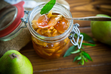 sweet fruit jam with apples and pears in a glass jar