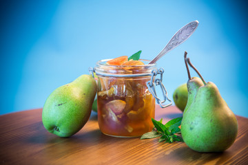 sweet fruit jam with apples and pears in a glass jar
