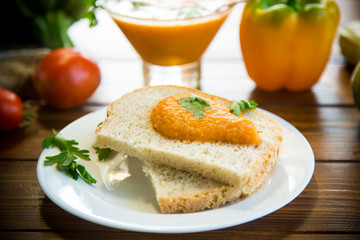 Homemade caviar of vegetables on a slice of bread