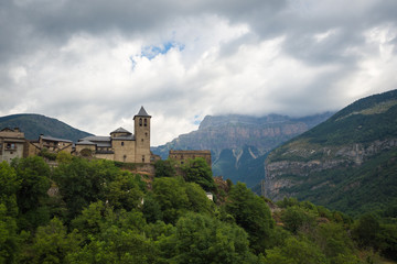 Torla Ordesa, church with the mountains at bottom, Pyrinees Spain