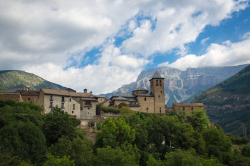 Torla Ordesa, church with the mountains at bottom, Pyrinees Spain