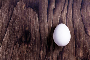 Happy Easter. Top view whole white eggs on old wooden rustic background. Copy space for text