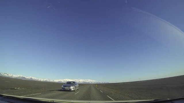 Driving on the beautiful roads of Iceland. Freedom concept. Traveller lifestyle. Wide angle lens time lapse video.