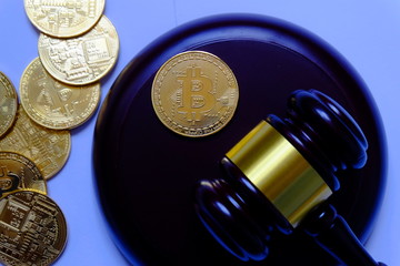 Law or auction concept with gavel and replica of gold bitcoin.Bitcoin cryptocurrency Internet business technology theme.