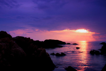 Beautiful seascape on tropical island Long exposure of the sunrise and Sun under the clouds on sea in the morning in Thailand