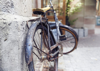 Fototapeta na wymiar Old bicycle parked on the street