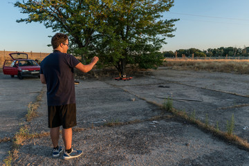 young boy prepares and flies competition drones, L.O.S. and F.P.V.