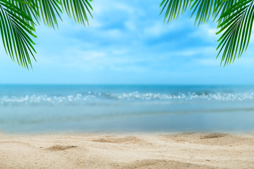 Fototapeta na wymiar Top of wood table with blurred sea and palm tree background,Concept Summer, Beach, Sea, Relax.