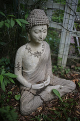 Buddha Statue Outdoors in a Garden Made from Cement Concrete