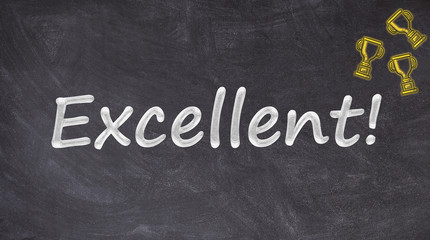 Obraz premium Excellent text on blackboard with trophies