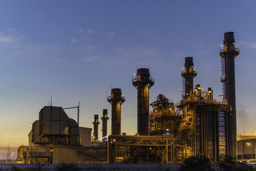 Fototapeta na wymiar Petrochemical Industrial. Oil refinery and Oil industry at sunset/sunrises. Space for add text