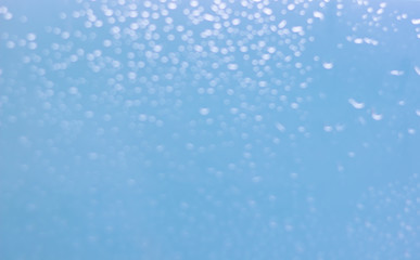 Waterdrops bokeh blue background