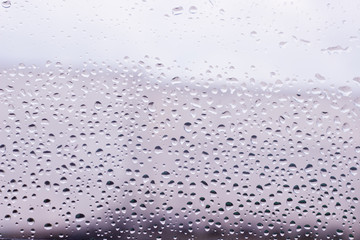 Waterdrops  after rain on clear glass.Water background