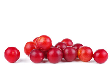 Pile of red cherry plums isolated on the white background