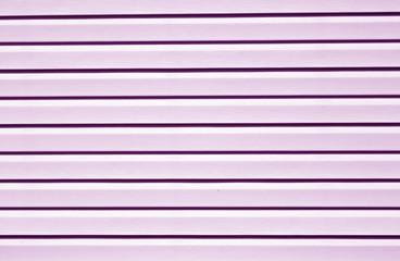 Plastic siding surface in purple tone.
