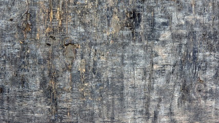 Old faded wooden texture of weathered black wood. Vintage rustic style. Natural dark surface, background and wallpaper.