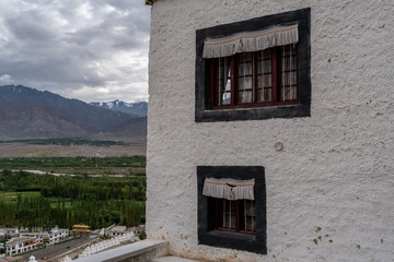Building of  Thiksey Monastery Tibetan Buddhism Temple with Mountain background