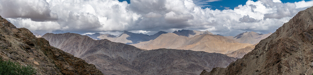 Fototapeta premium Panorama of Mountains with Cloudy sky in in Leh Ladakh, Jammu and Kashmir, India
