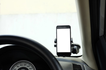 Mockup Smartphone in a car use for Navigate or GPS. Smartphone in holder. Mobile phone with...