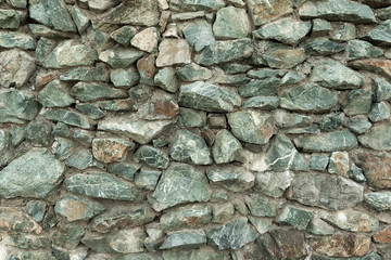 texture of a wall made of stone cobblestones. architecture, structure.